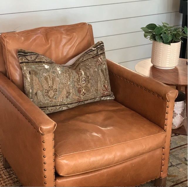 Persian pillow cover on a leather couch