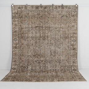 Handmade 7x9 area rug in brown, ideal for a cozy living room, bedroom, office, entryway, kitchen