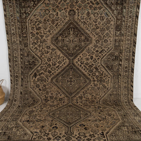 Handmade 7x10 area rug in brown, ideal for a cozy living room, bedroom, office, dining room, kitchen