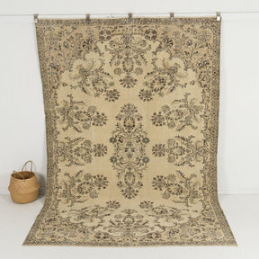 Handmade 6x9 area rug in beige, ideal for a cozy living room, bedroom, dining room