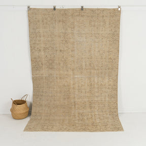 Handmade 5x8 area rug in beige, ideal for a cozy bedroom, office, entryway