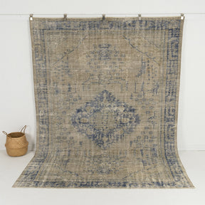 Handmade 7x10 area rug in blue, ideal for a cozy living room, bedroom