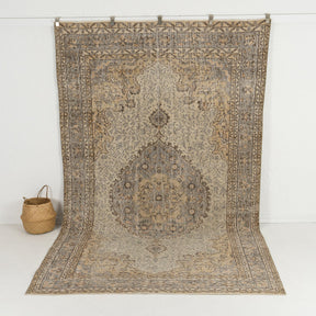 Handmade 6x10 area rug in beige, ideal for a cozy living room, dining room, bedroom, office