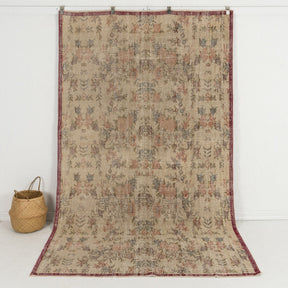 Handmade 5x9 area rug in beige, ideal for a cozy living room, bedroom