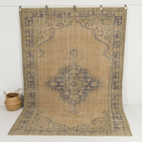 Handmade 7x10 area rug in beige, ideal for a cozy living room, bedroom