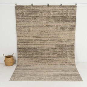 Handmade 8x10 area rug in beige, ideal for a cozy living room, bedroom, dining room, office