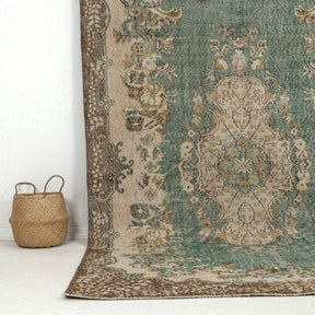 Authentic 6x10 area rug from turkish, in subtle green tones