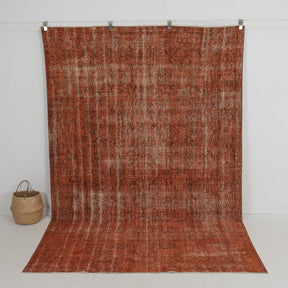 Handmade 7x10 area rug in orange, ideal for a cozy living room, bedroom, dining room, entryway, office