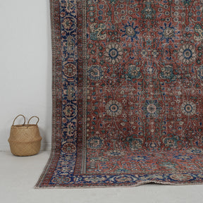 Authentic 7x10 area rug from turkish, in subtle red tones