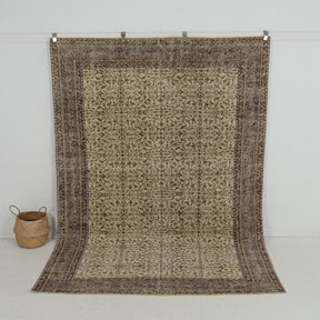 Handmade 7x10 area rug in brown, ideal for a cozy living room, bedroom, dining room, entryway, office