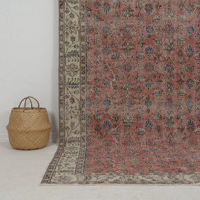 Authentic 6x10 area rug from turkish, in subtle red tones