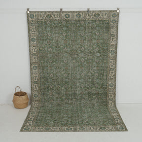 Handmade 6x10 area rug in green, ideal for a cozy living room, bedroom, dining room, entryway, office