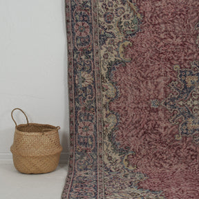 Authentic 7x11 area rug from turkish, in subtle red tones