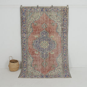 Handmade 5x8 area rug in red, ideal for a cozy living room, bedroom, dining room, office