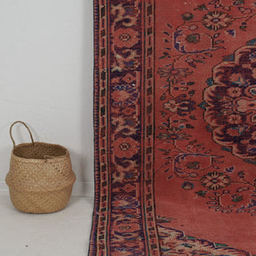 Authentic 6x10 area rug from turkish, in subtle red tones