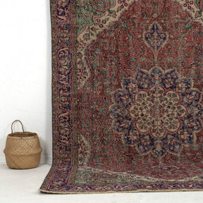 Authentic 6x10 area rug from turkish, in subtle red tones