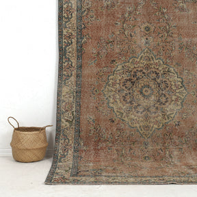 Authentic 6x9 area rug from turkish, in subtle orange tones