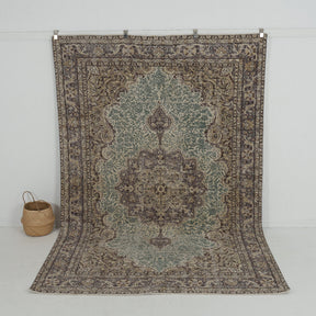 Handmade 7x10 area rug in green, ideal for a cozy living room, bedroom, entryway, office, kitchen & dining