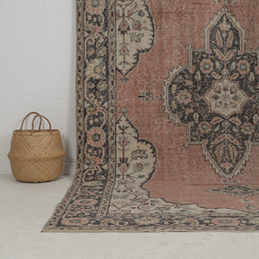 Authentic 6x10 area rug from turkish, in subtle pink tones