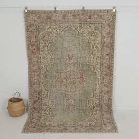 Handmade 5x9 area rug in green, ideal for a cozy living room, bedroom, entryway, office, kitchen & dining