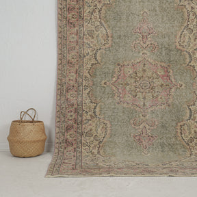 Authentic 5x9 area rug from turkish, in subtle green tones