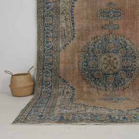 Authentic 7x10 area rug from turkish, in subtle orange tones