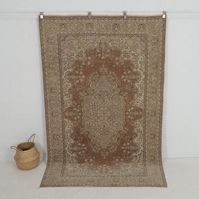 Handmade 5x8 area rug in brown, ideal for a cozy living room, bedroom, entryway, office, kitchen & dining