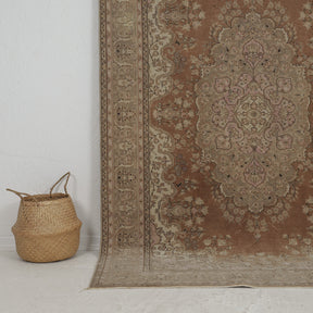 Authentic 5x8 area rug from turkish, in subtle brown tones