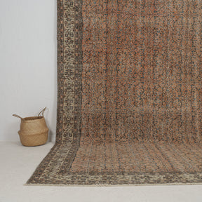 Authentic 7x10 area rug from turkish, in subtle orange tones