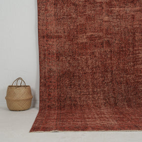 Authentic 6x10 area rug from turkish, in subtle red tones