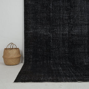 Authentic 6x10 area rug from turkish, in subtle black tones