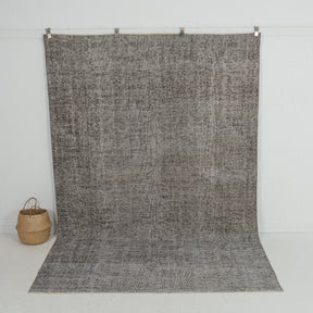 Handmade 7x10 area rug in gray, ideal for a cozy living room, bedroom, dining room, entryway, office