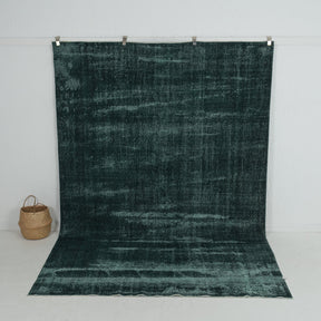 Handmade 7x10 area rug in green, ideal for a cozy living room, bedroom, dining room, entryway, office